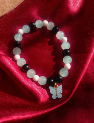 Green,Black,White glass bead bracelet with butterfly charm