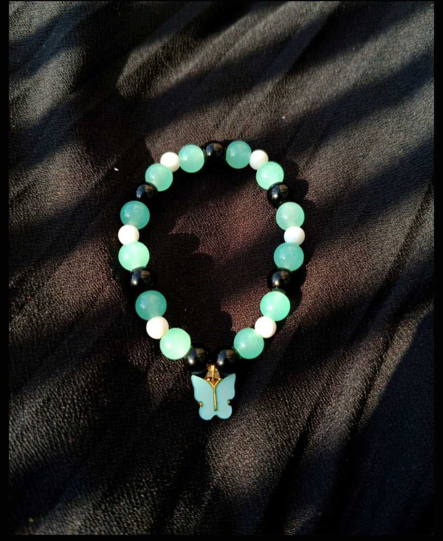 Green,Black,White glass bead bracelet with butterfly charm