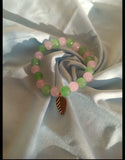 Pink and Green glass beaded bracelet with leaf cham